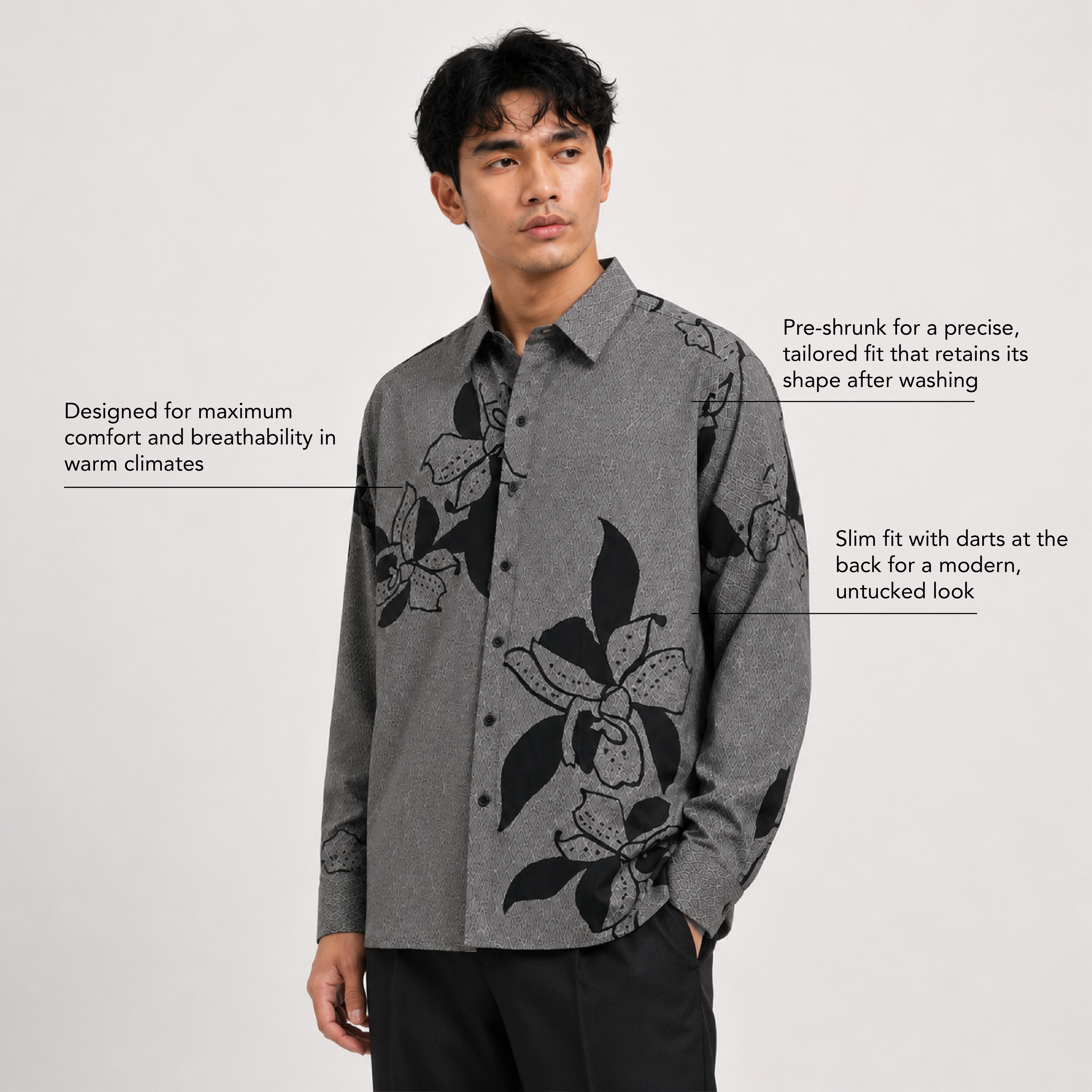 Man wearing a gray floral shirt on a white background