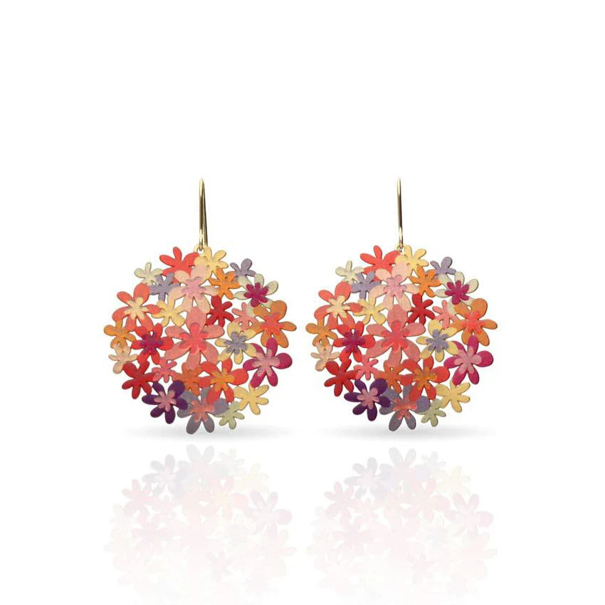 Colorful floral earrings on a white background