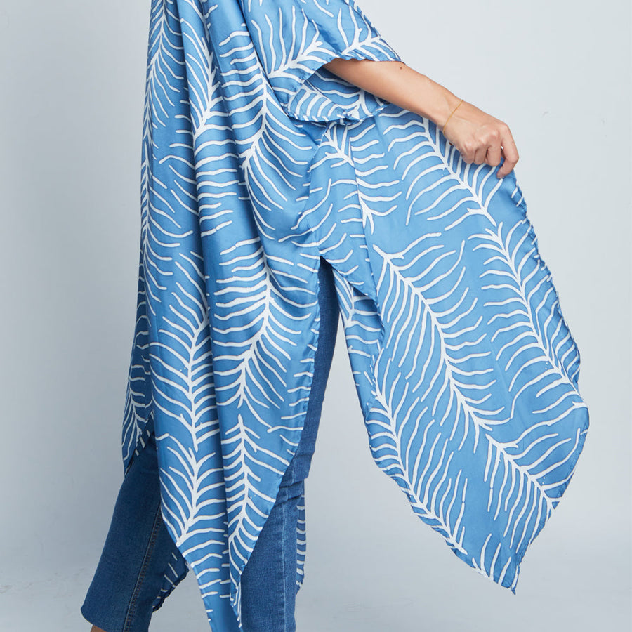 Closeup of a model showcasing cotton silk batik Kimono in Blue Fern, handcrafted in Malaysia.