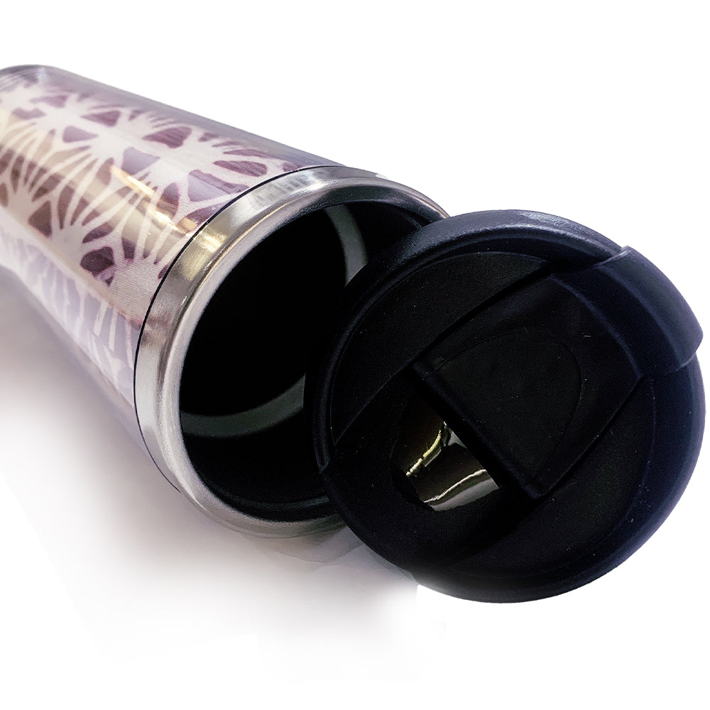 a plum firework tumbler made of batik with its lid open against a neutral background