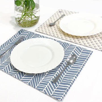 A lifestyle photo of batik homeware consist of placemat in grey banana leaf print