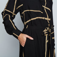 Close up of batik long shirt dress in Black Ecru brush, handcrafted in Malaysia.