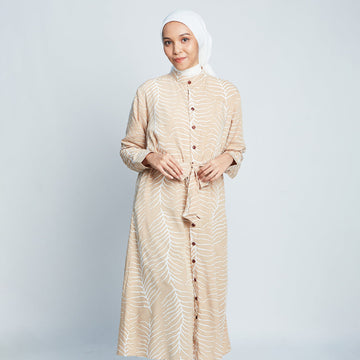 Muslim woman wearing batik long shirt dress in Latte Fern, handprinted in Malaysia.