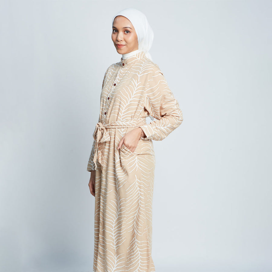  Muslim woman sideview wearing batik long shirt dress in Latte Fern, handprinted in Malaysia.