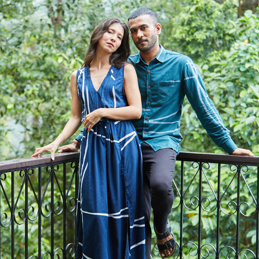 Couple wearing batik dress and shirt, handprinted by artisans in Malaysia.