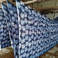 a photo of authentic batik hanging to dry