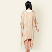 Model facing from the back with batik long Kimono in Latte Fern, using traditional Malaysian printing method.
