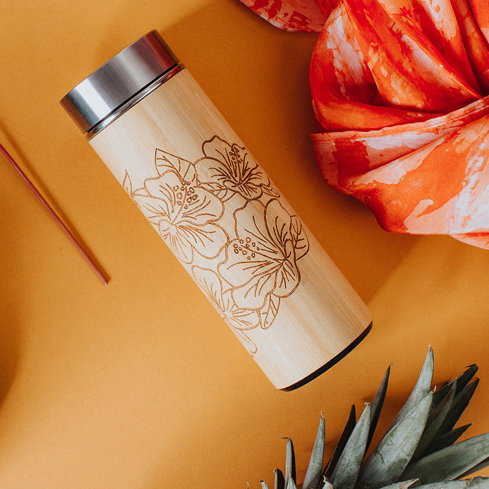 lifestyle photo of wooden tumbler inspired from batik in hibiscus pattern