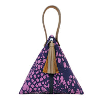 a ketupat bag made of batik in the pattern purple bintik against a neutral bag showcasing the front of the bag