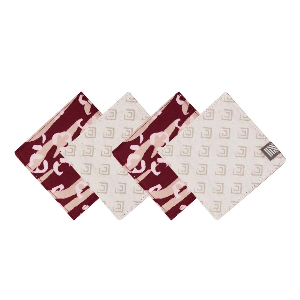 white box photo of four coasters made of batik in the pattern crimson tiger