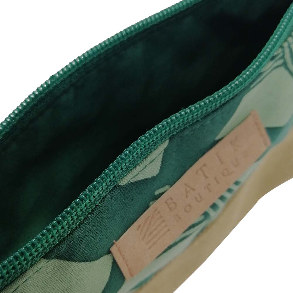 a closeup photo of a green nasi lemak zip pouch made of batik showcasing the details