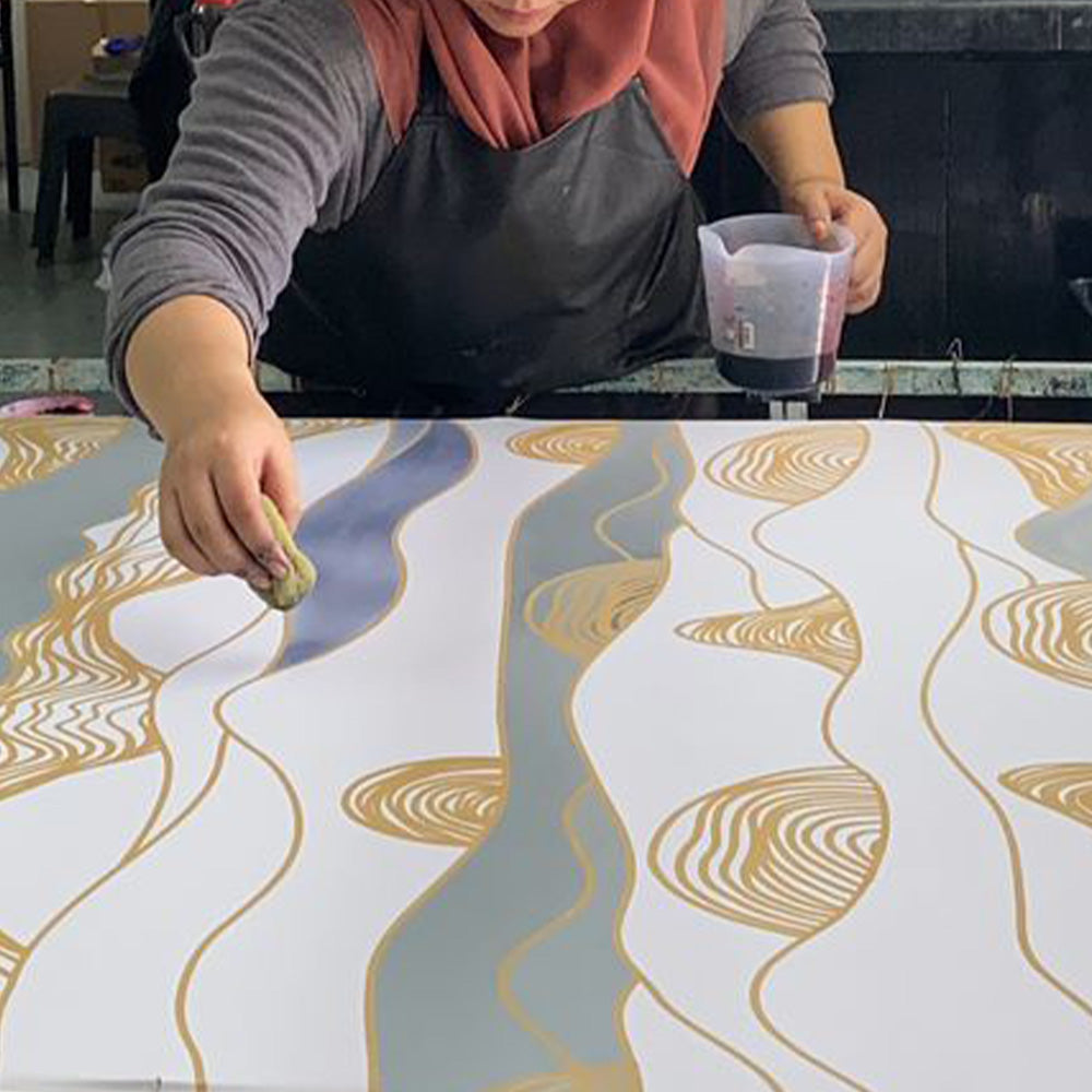 Intricate batik process hand-waxed by two people from Raya 2023 batik collection inspired by Malaysia's hills.