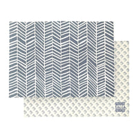 batik placemat set in the pattern grey banana leaf presented against a neutral background