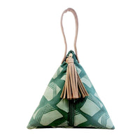 a photo of a bag made of batik in the shape similar to a ketupat in the pattern green nasi lemak