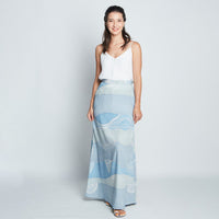 Blue batik long flare skirt with Sky Bukit print, full body view on female model.