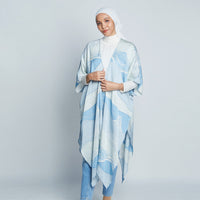 Woman wearing blue batik kimono in Sky Bukit print from Batik Boutique inspired by Malaysia's hills.
