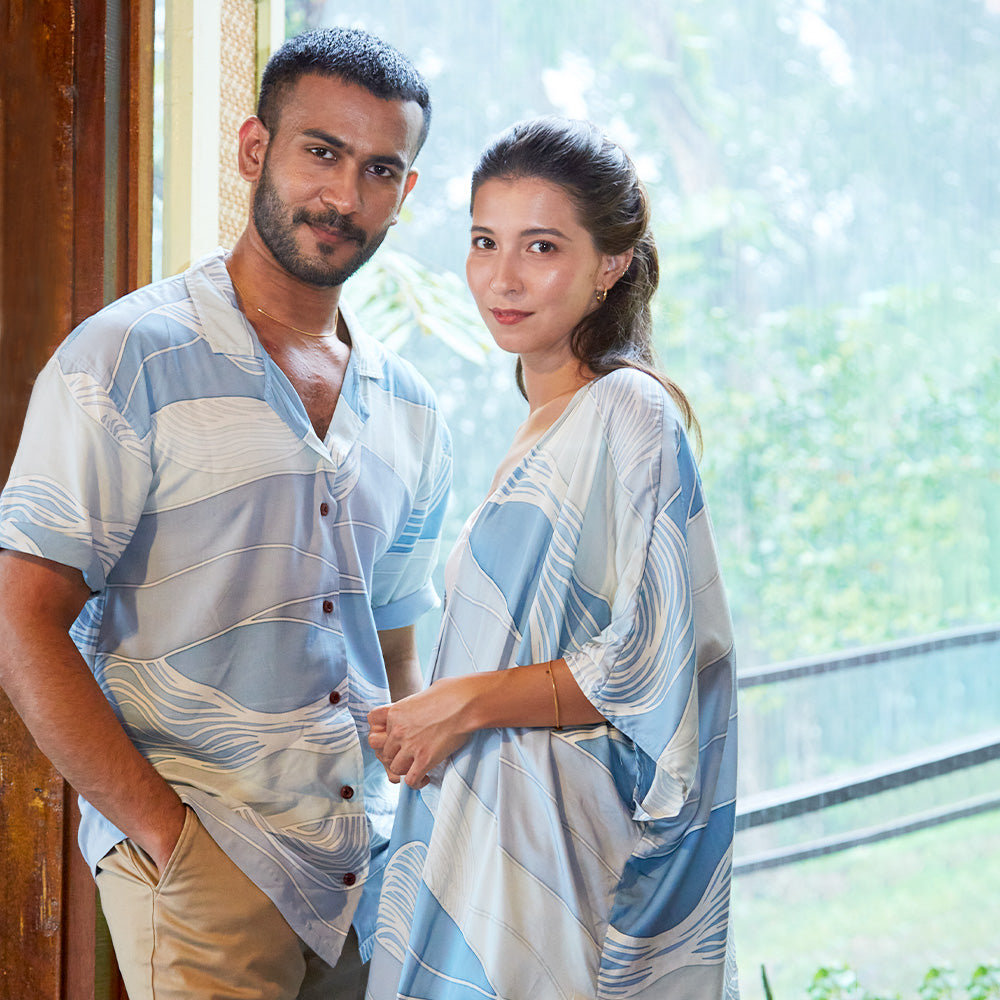 Malaysian couple in matching blue Sky Bukit batik outfits from Batik Boutique