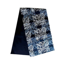 a whitebox photo of batik table runner in blue nautical fern pattern showing front and back of the table runner