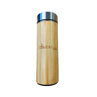 An image of the rear side of a tumbler with the phrase 'Makan Lah' elegantly engraved, placed against a neutral background